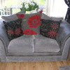 2 x 2 seater sofas in grey material with red poppy cushions