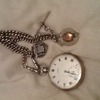 Solid silver antique pocket watch and chain. Perfect working order.