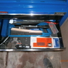 draper blue tool chest and roller cabinet with tools.