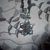 necklace with large silver colour rose