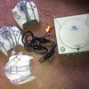 sega dreamcast with 1 game and 5 controllers