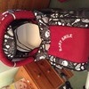 Red and black skull print pram