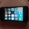 Apple iPhone 4 in black on orange EE network with charger