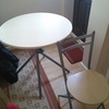 Round table with 4 matching folding chairs.