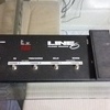 line 6 amp, floor board & guitar.