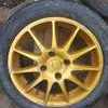 4 gold Nissan wheels and tyres