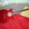 red double cutaway electro guitar