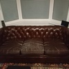 3 seater brown Chesterfield sofas.